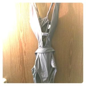 never been used swimsuit! It enhances any body